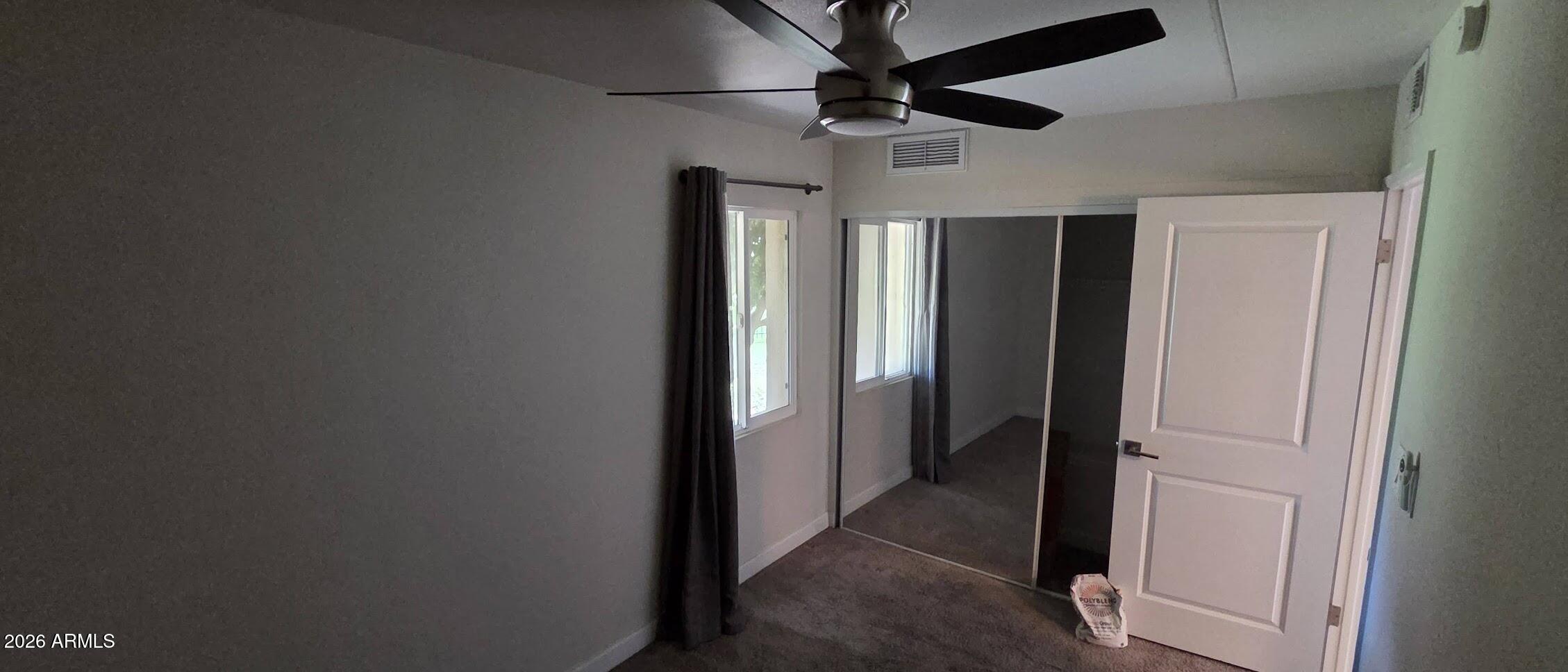 7910 East Camelback Road, Unit 104 Scottsdale, AZ 85251 - Photo 37 of 38 a view of hallway with a ceiling fan
