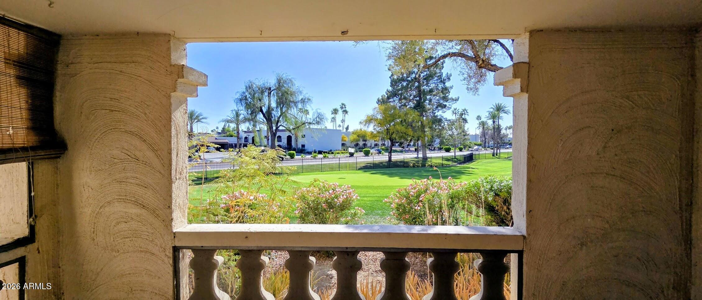 7910 East Camelback Road, Unit 104 Scottsdale, AZ 85251 - Photo 4 of 38 a view of a porch with a yard