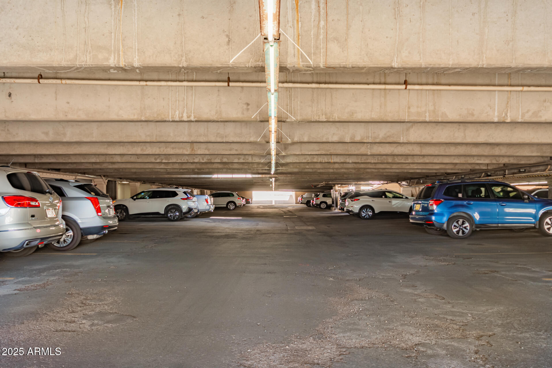 7910 East Camelback Road, Unit 104 Scottsdale, AZ 85251 - Photo 10 of 38 a view of car parked in parking