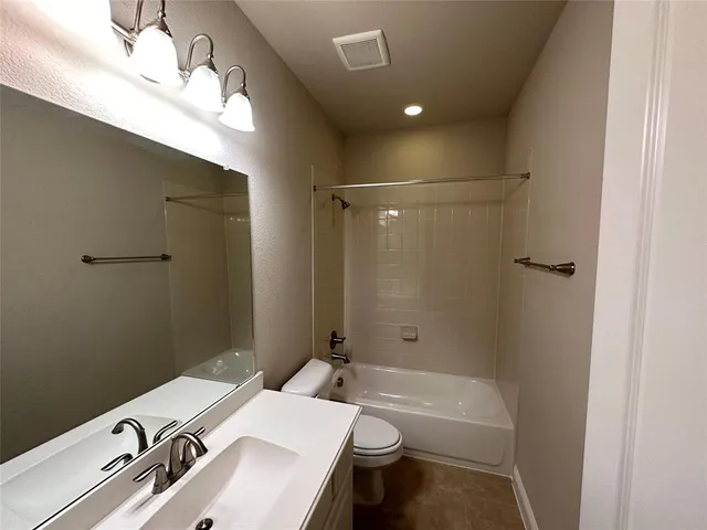 a view of a yard with a wooden fence