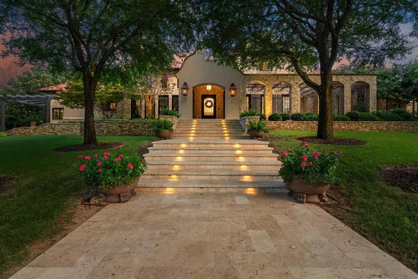 a front view of a house with garden