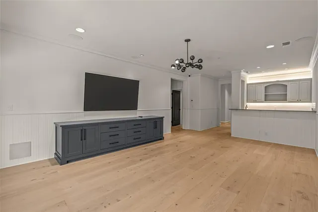 a view of a room with cabinet and flat screen tv