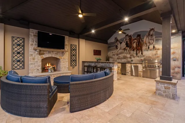 an aerial view of residential house with outdoor space and parking