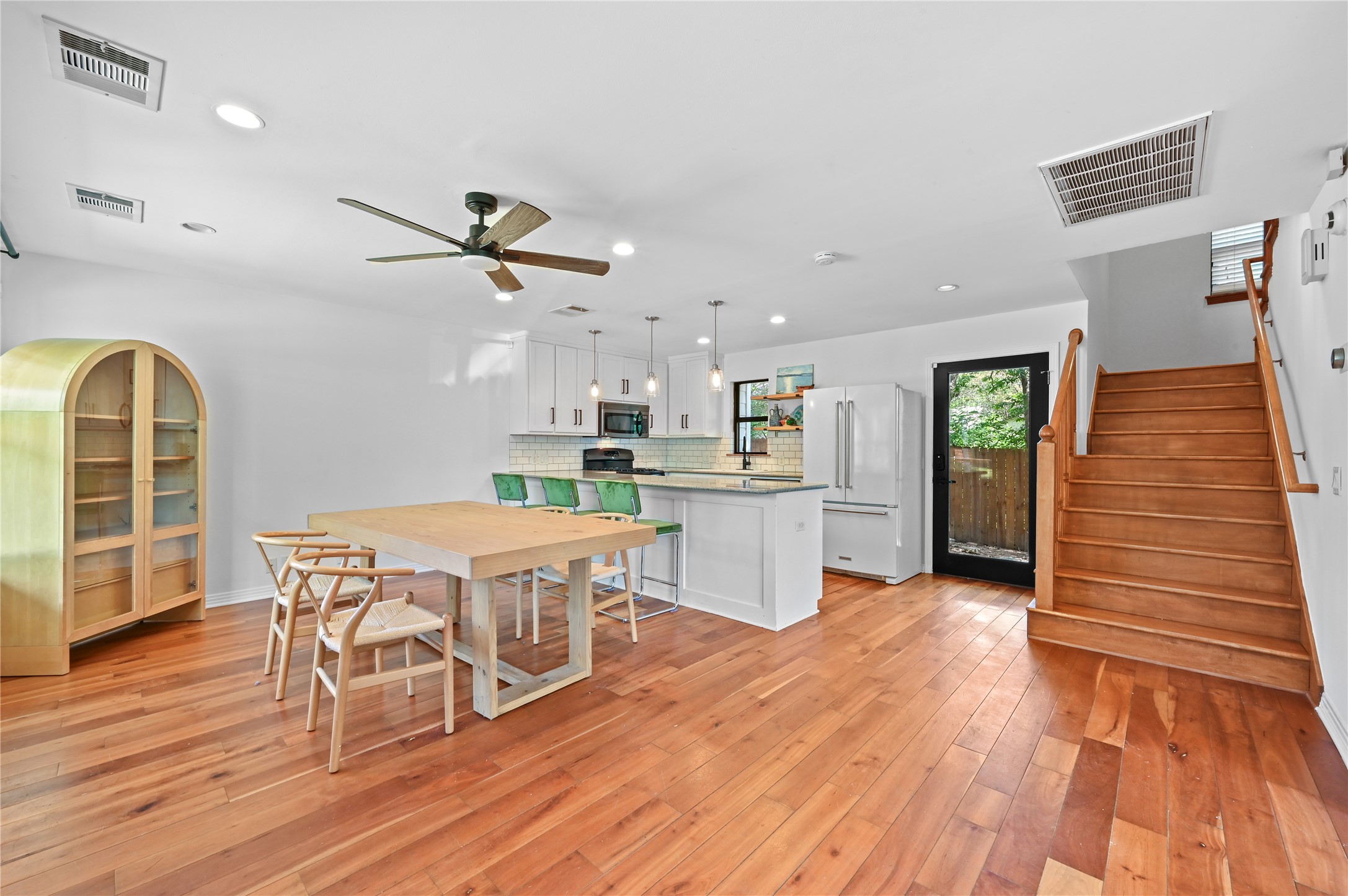 2107 East 13th Street Austin, TX 78702 - Photo 11 of 25 a dining room with furniture and wooden floor