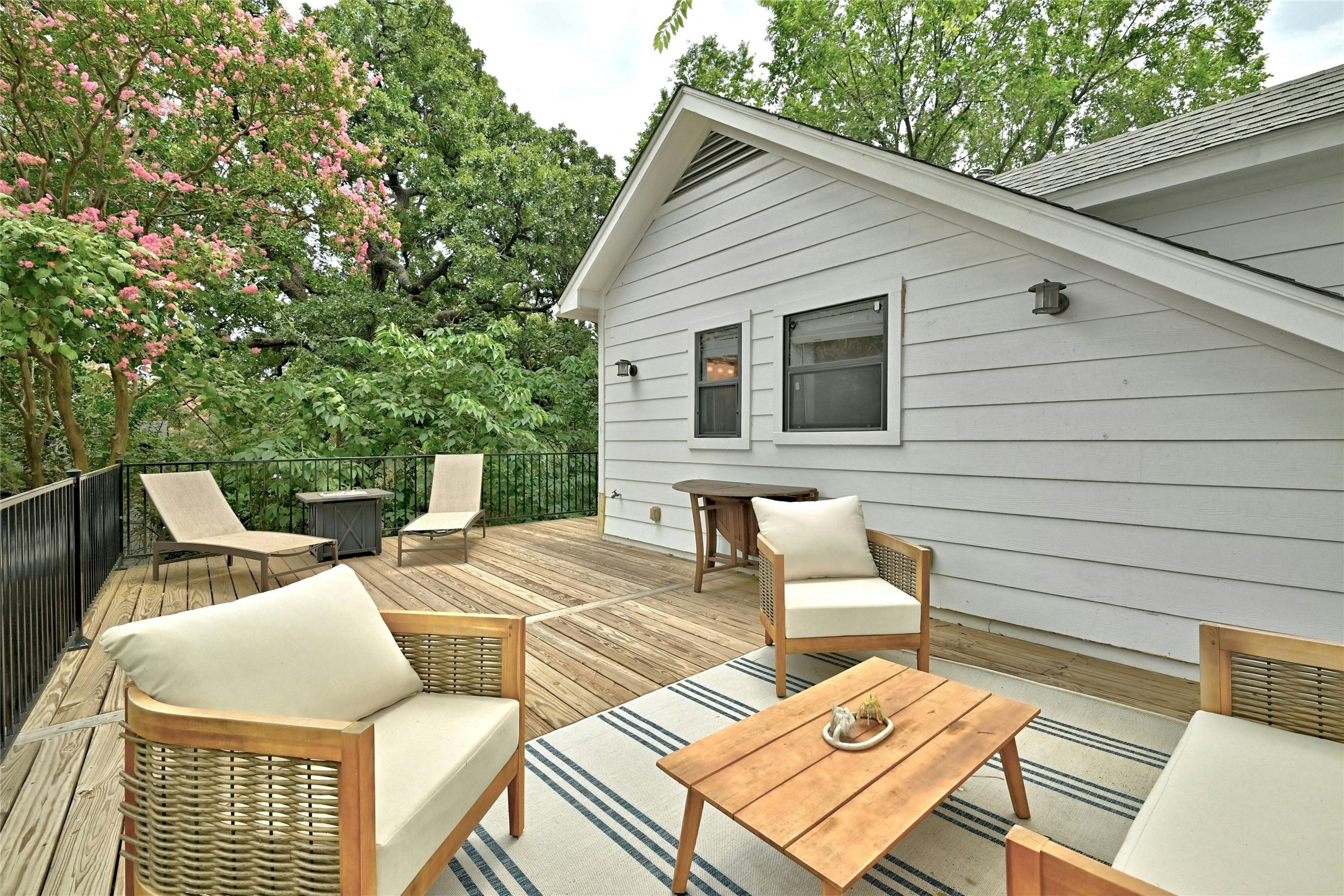 2107 East 13th Street Austin, TX 78702 - Photo 12 of 25 a view of a patio with couches table and chairs and potted plants