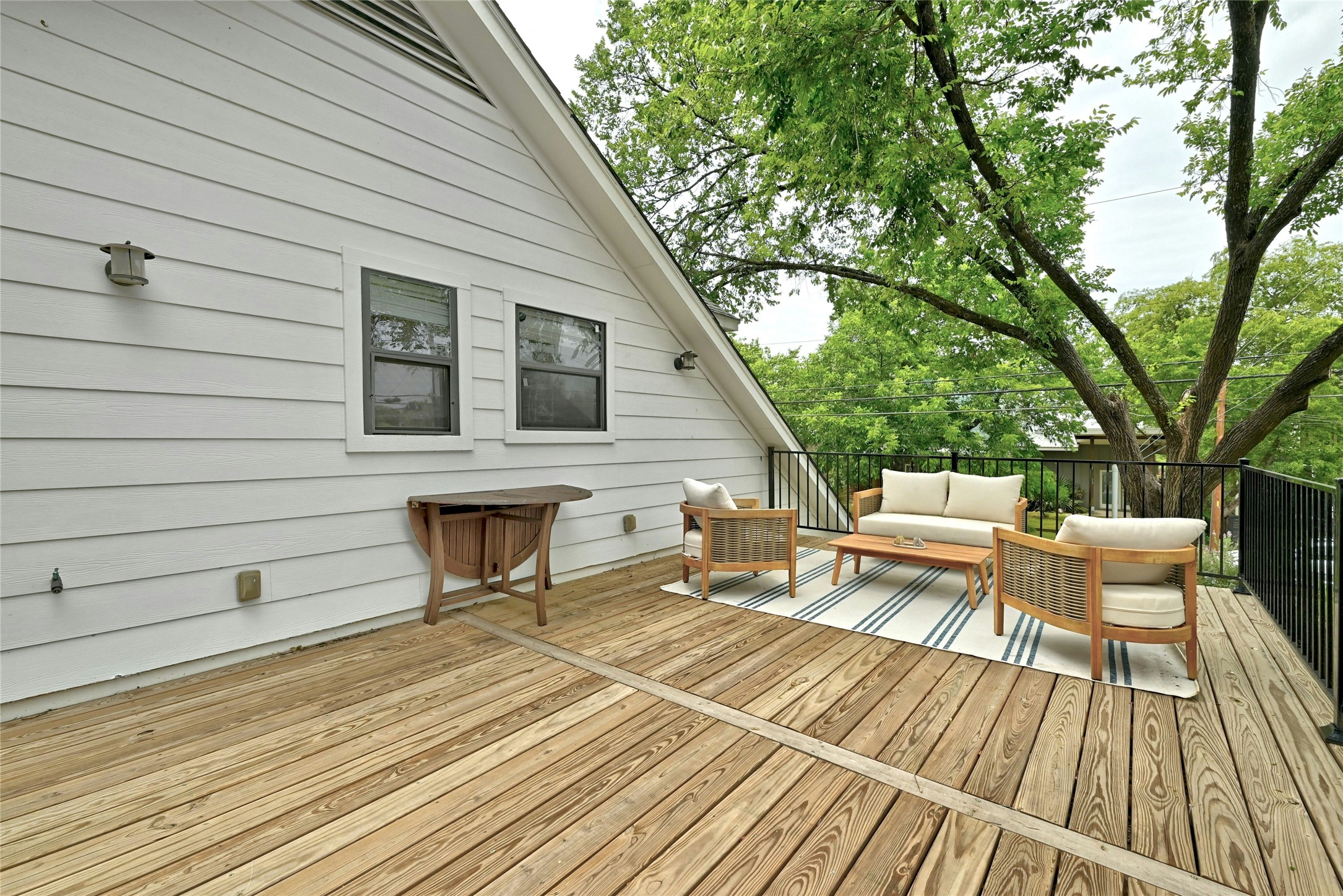2107 East 13th Street Austin, TX 78702 - Photo 13 of 25 a view of a chairs on the deck