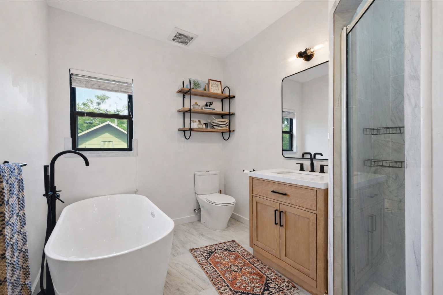 2107 East 13th Street Austin, TX 78702 - Photo 18 of 25 a bathroom with a toilet sink and mirror