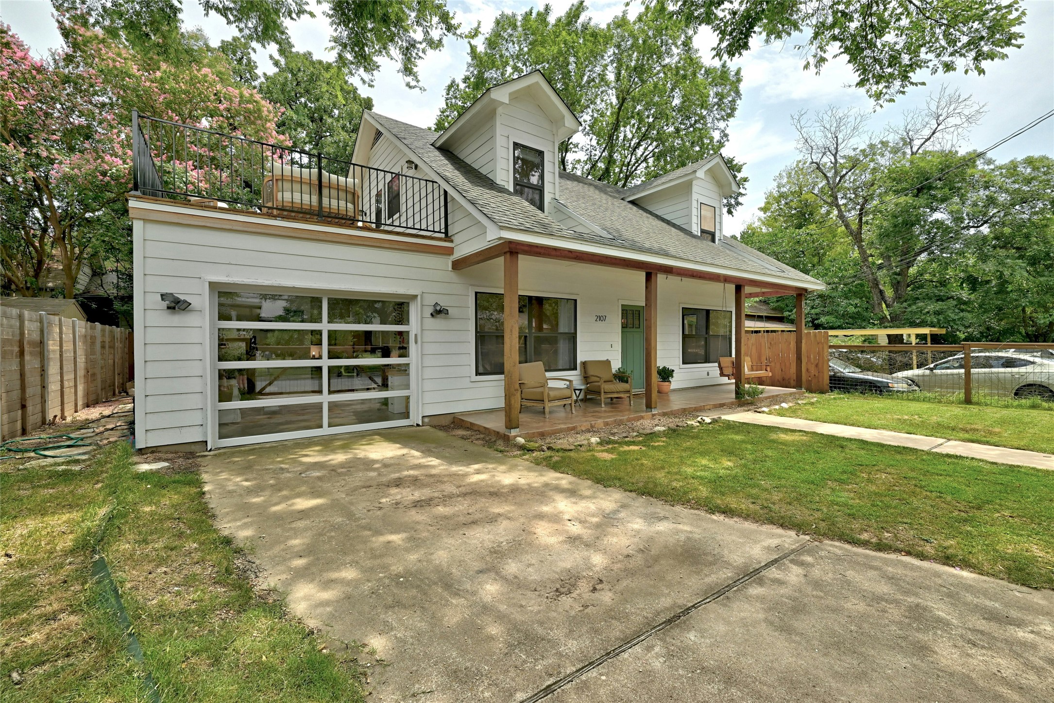 2107 East 13th Street Austin, TX 78702 - Photo 23 of 25 a view of a house with backyard and porch