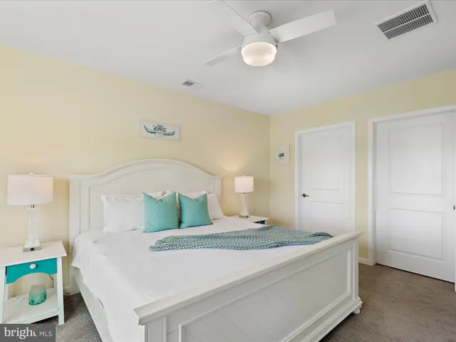 a bed room with a bed and a large window