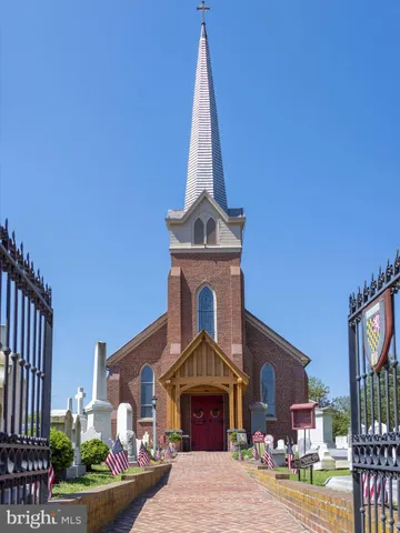 a front view of a building with garden