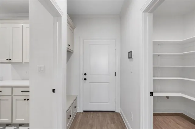 a bathroom with white cabinets