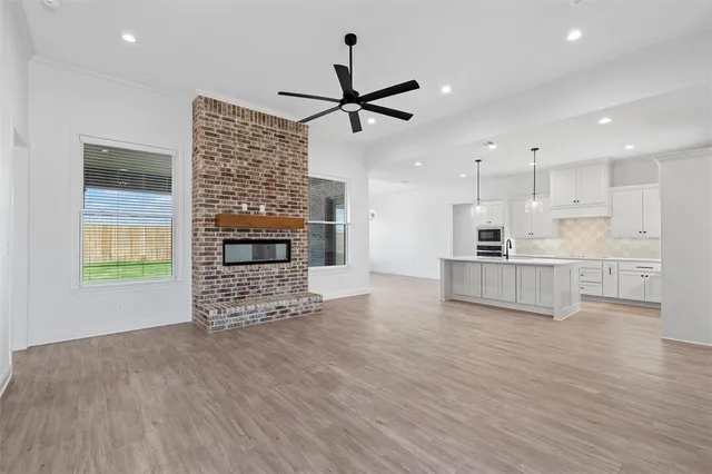 a view of kitchen with furniture and a fireplace