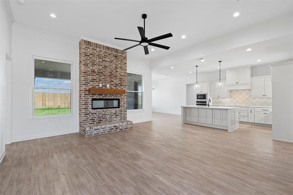 2113 Holborn Street Lorena, TX 76655 - Photo 3 of 31 a view of kitchen with furniture and a fireplace