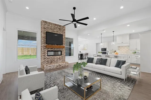 a living room with furniture and a fireplace