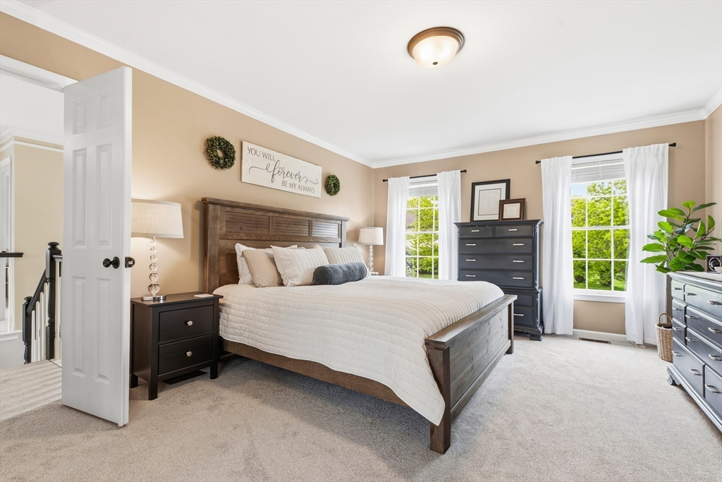6 Hancock Road Franklin, MA 02038 - Photo 21 of 32 a spacious bedroom with a bed and a dresser