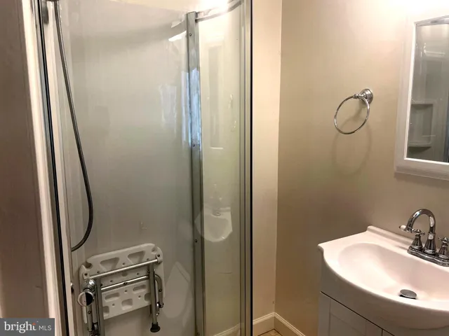 a bathroom with a tub and shower