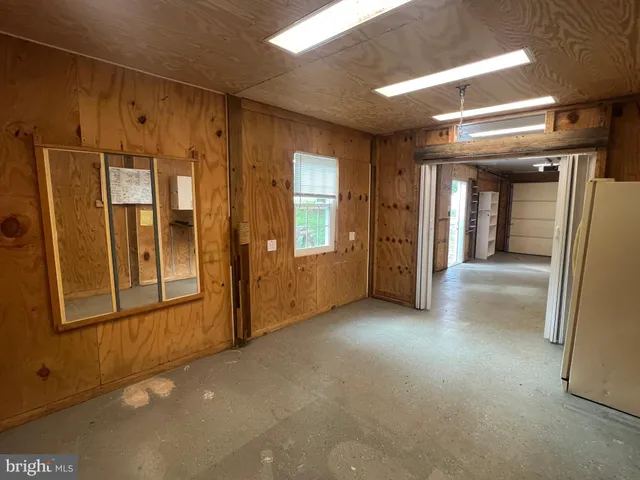 a view of house exterior with open window and door