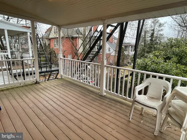 a view of balcony with furniture