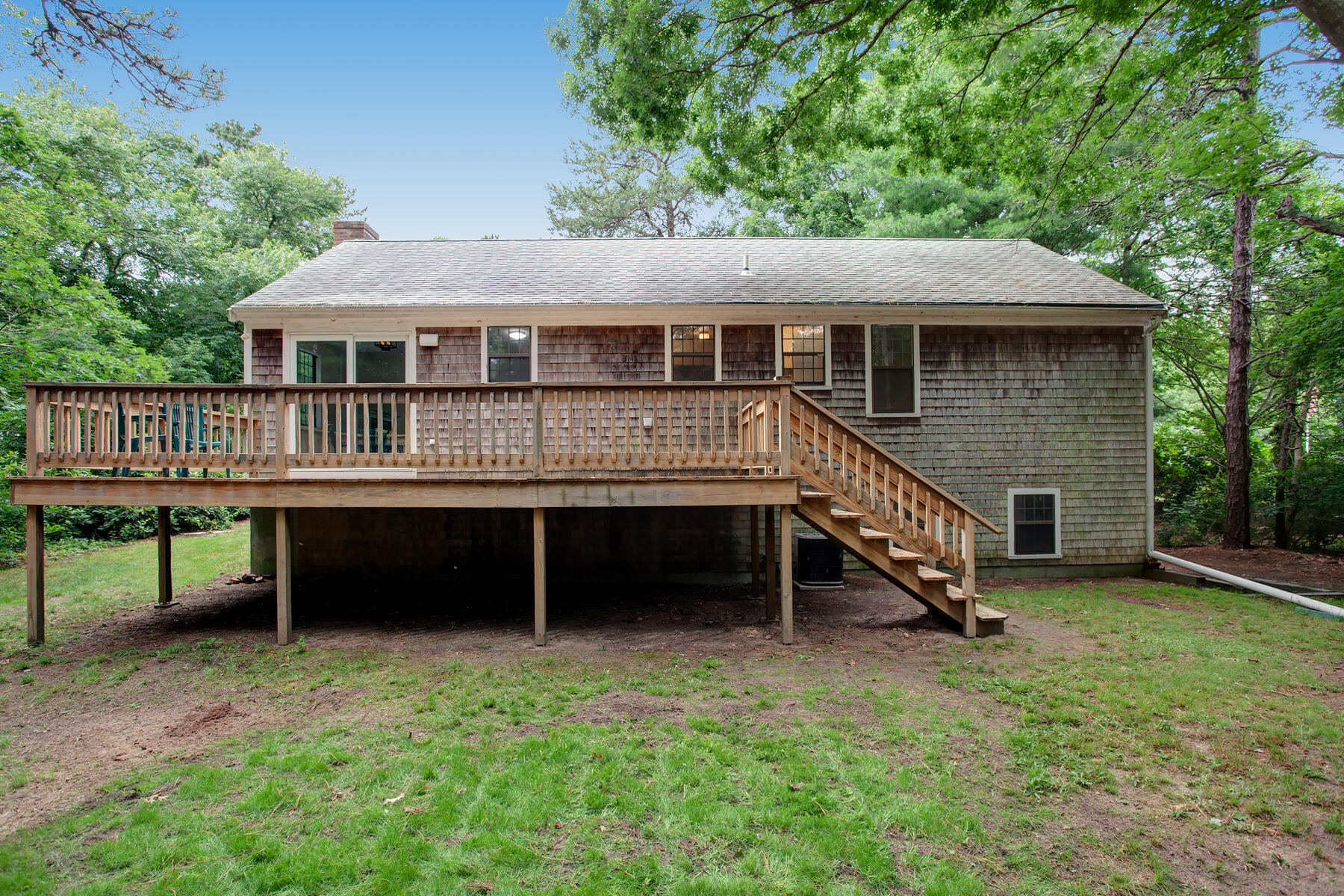 211 Oldham Road Osterville, MA 02655 - Photo 21 of 26 a view of a house with a wooden deck and a yard