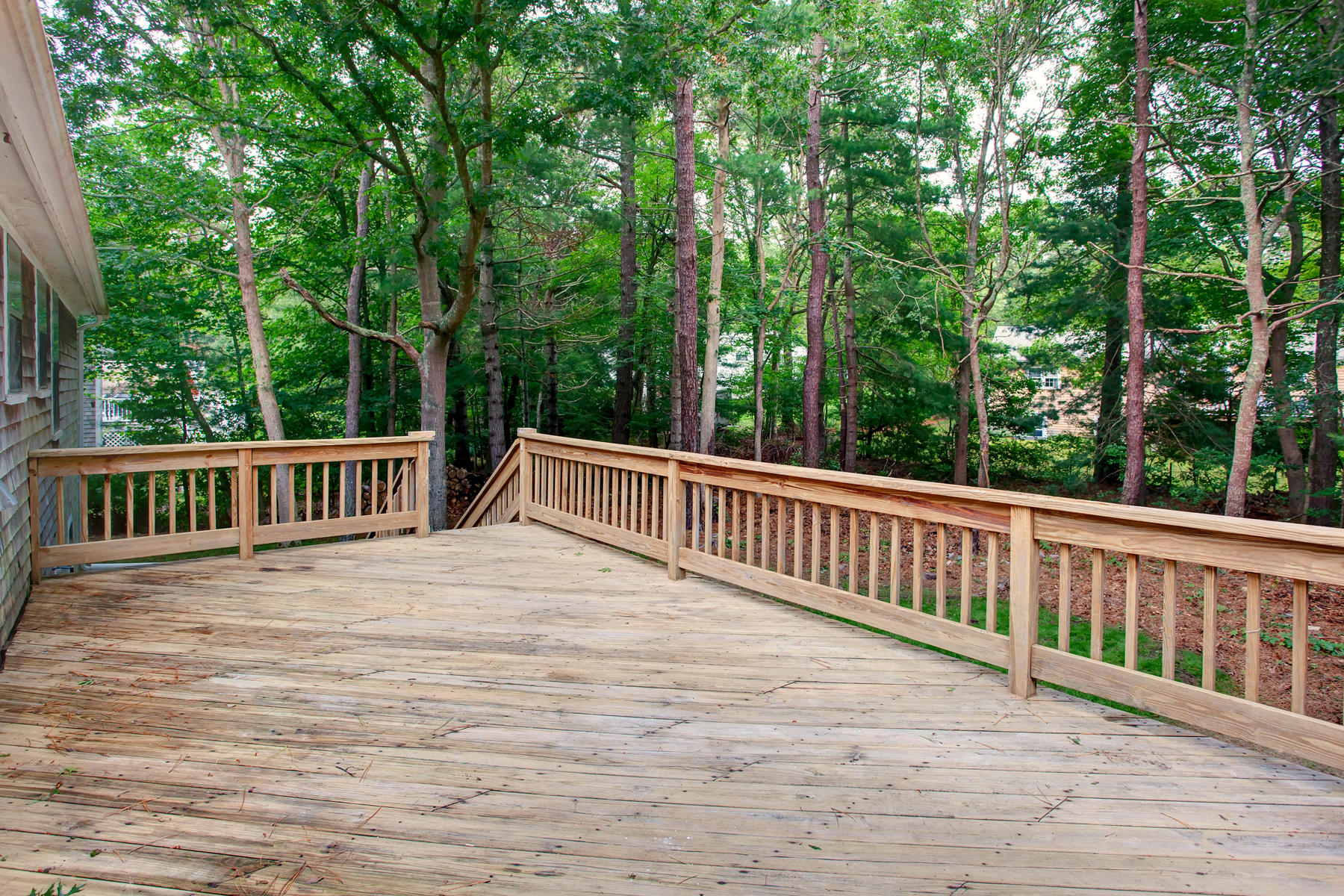 211 Oldham Road Osterville, MA 02655 - Photo 24 of 26 a view of a wooden deck and trees