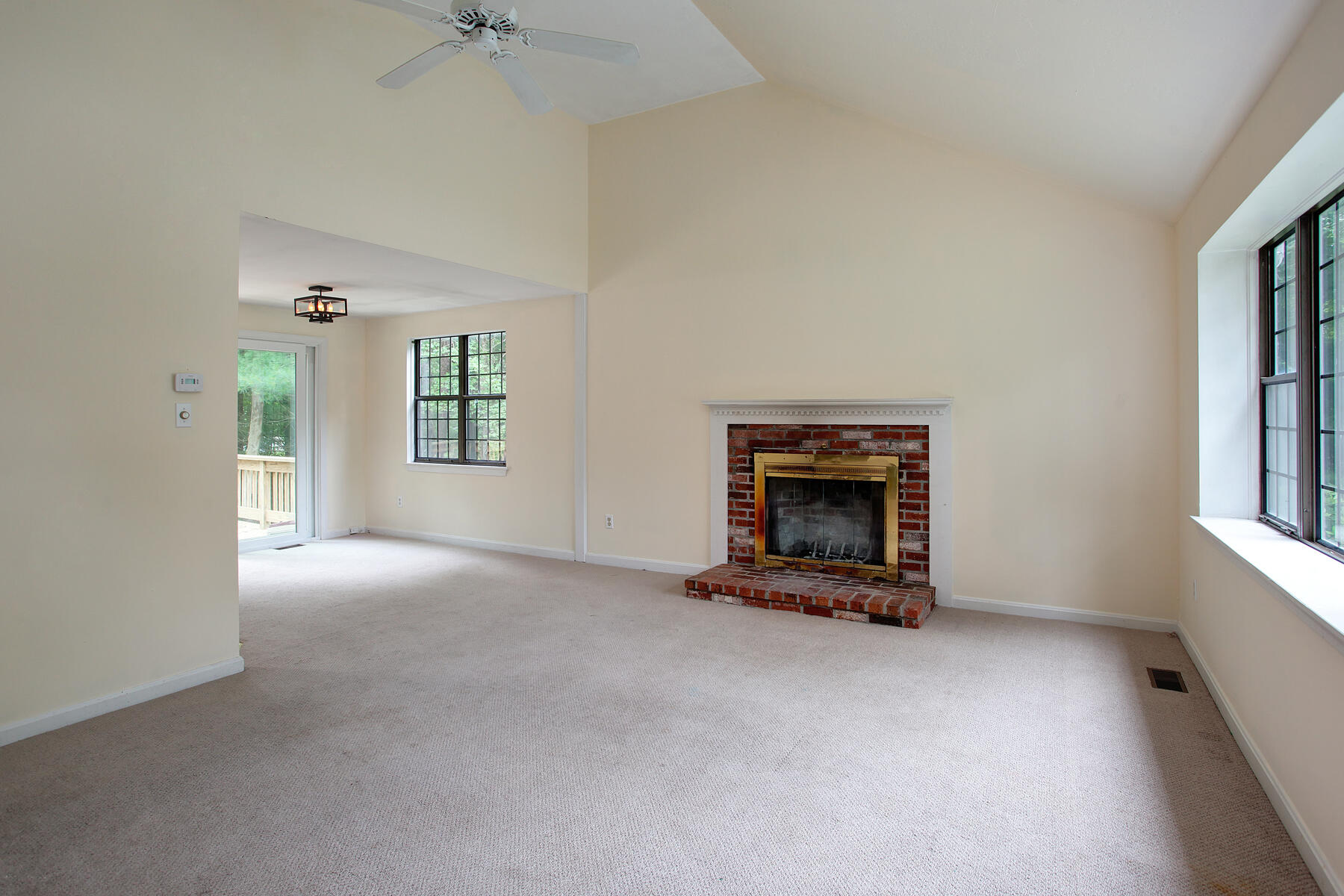 211 Oldham Road Osterville, MA 02655 - Photo 5 of 26 an empty room with windows and fireplace