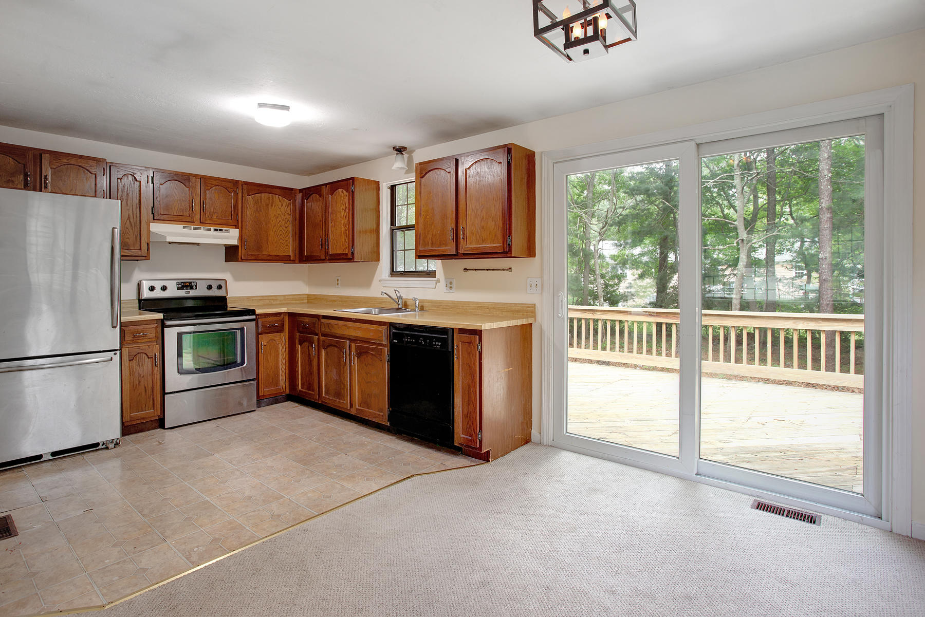 211 Oldham Road Osterville, MA 02655 - Photo 7 of 26 a kitchen with stainless steel appliances granite countertop a stove a sink and a refrigerator