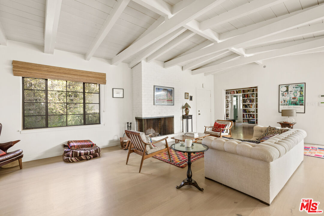 830 Brooktree Road Pacific Palisades, CA 90272 - Photo 11 of 37 a living room with furniture and a large window