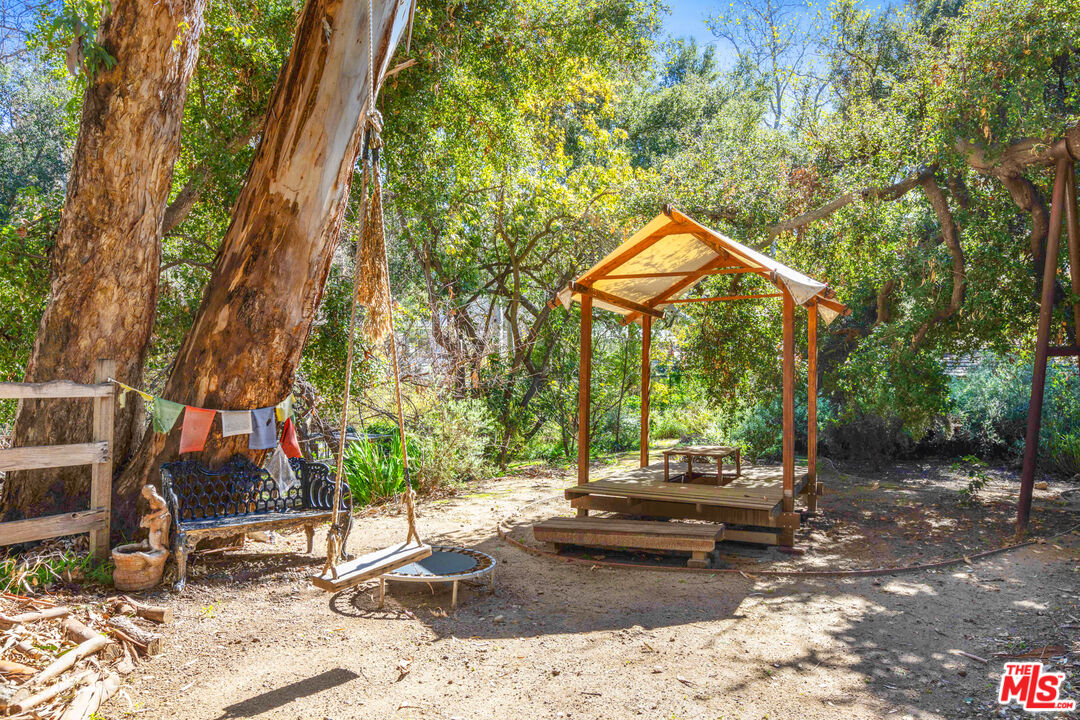 830 Brooktree Road Pacific Palisades, CA 90272 - Photo 36 of 37 a backyard of a house with barbeque oven