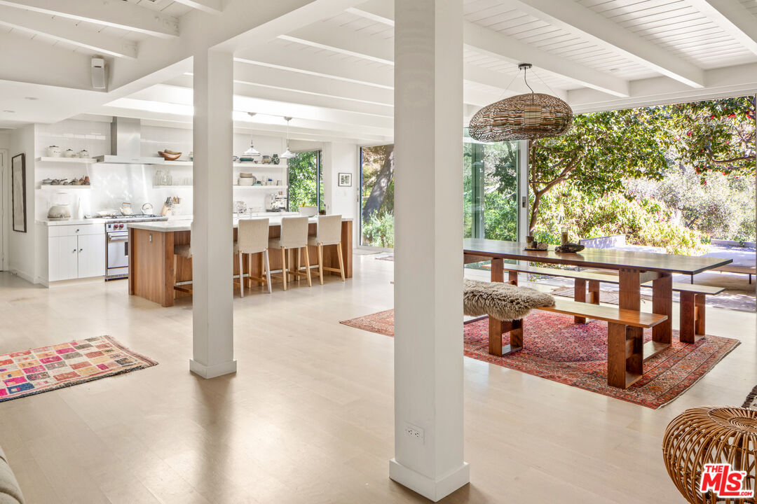 830 Brooktree Road Pacific Palisades, CA 90272 - Photo 7 of 37 a hallway with furniture and a large window