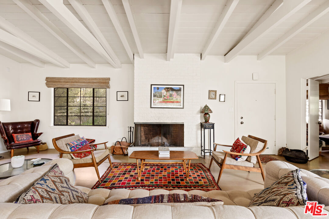 830 Brooktree Road Pacific Palisades, CA 90272 - Photo 10 of 37 a living room with furniture or couch and a window