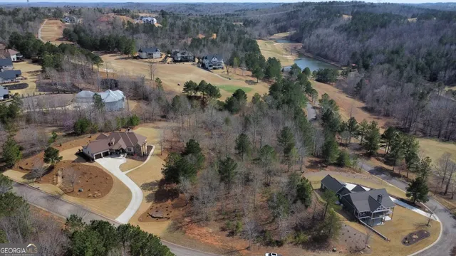 an aerial view of a house with a yard