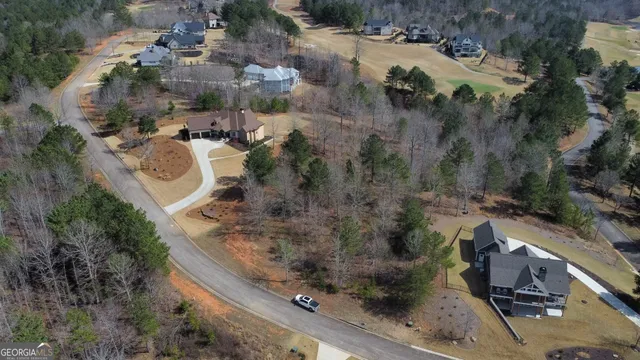 an aerial view of house with yard