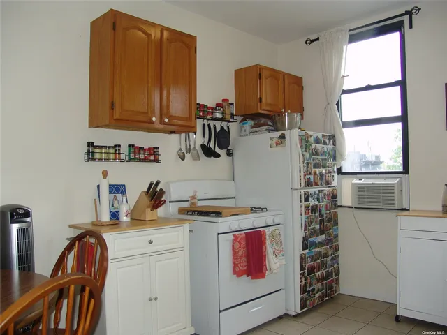 a room with sink and cabinets