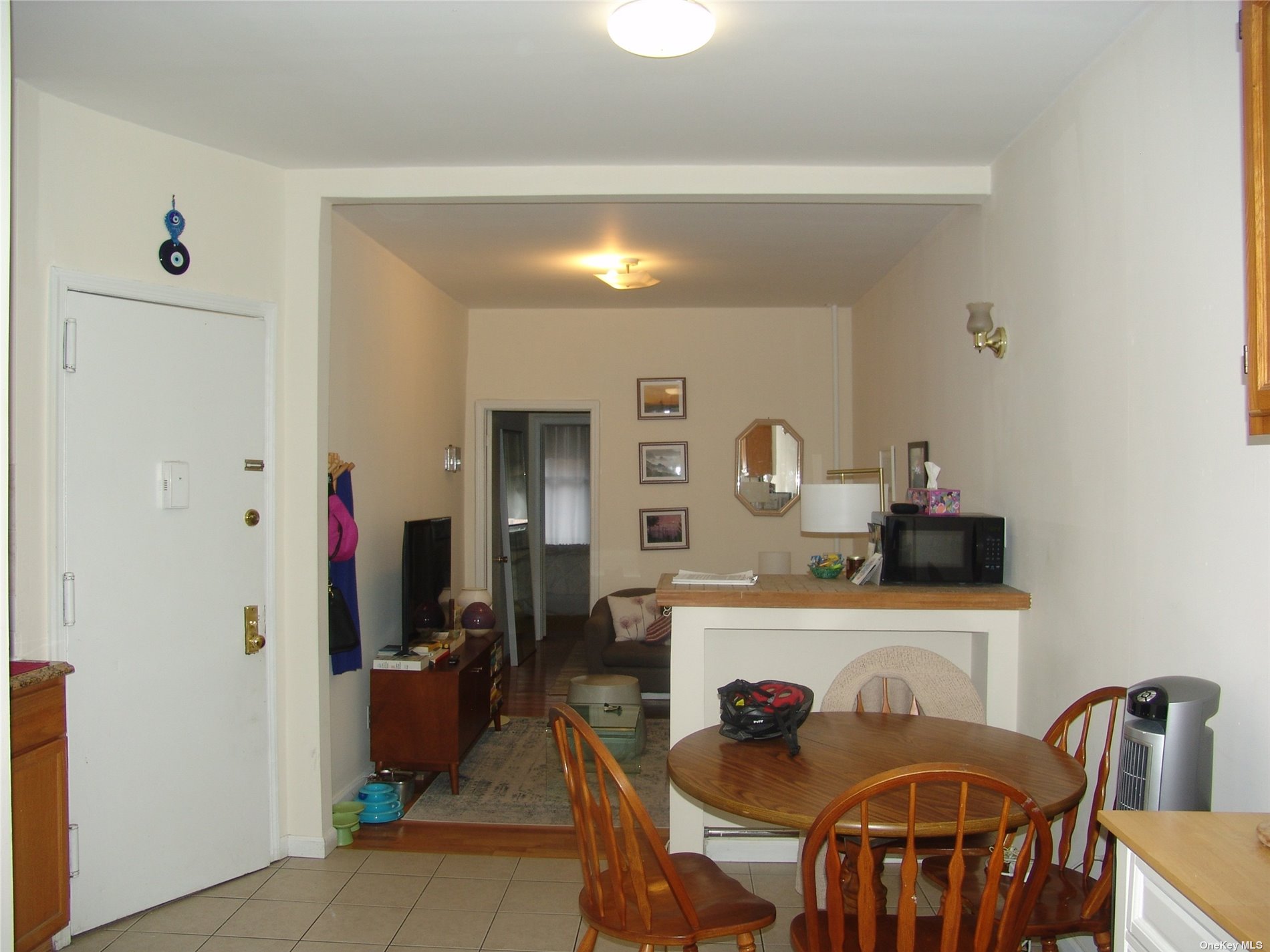1724 8th Avenue, Unit 6 Brooklyn, NY 11215 - Photo 16 of 36 a view of a dining room with furniture and a chandelier
