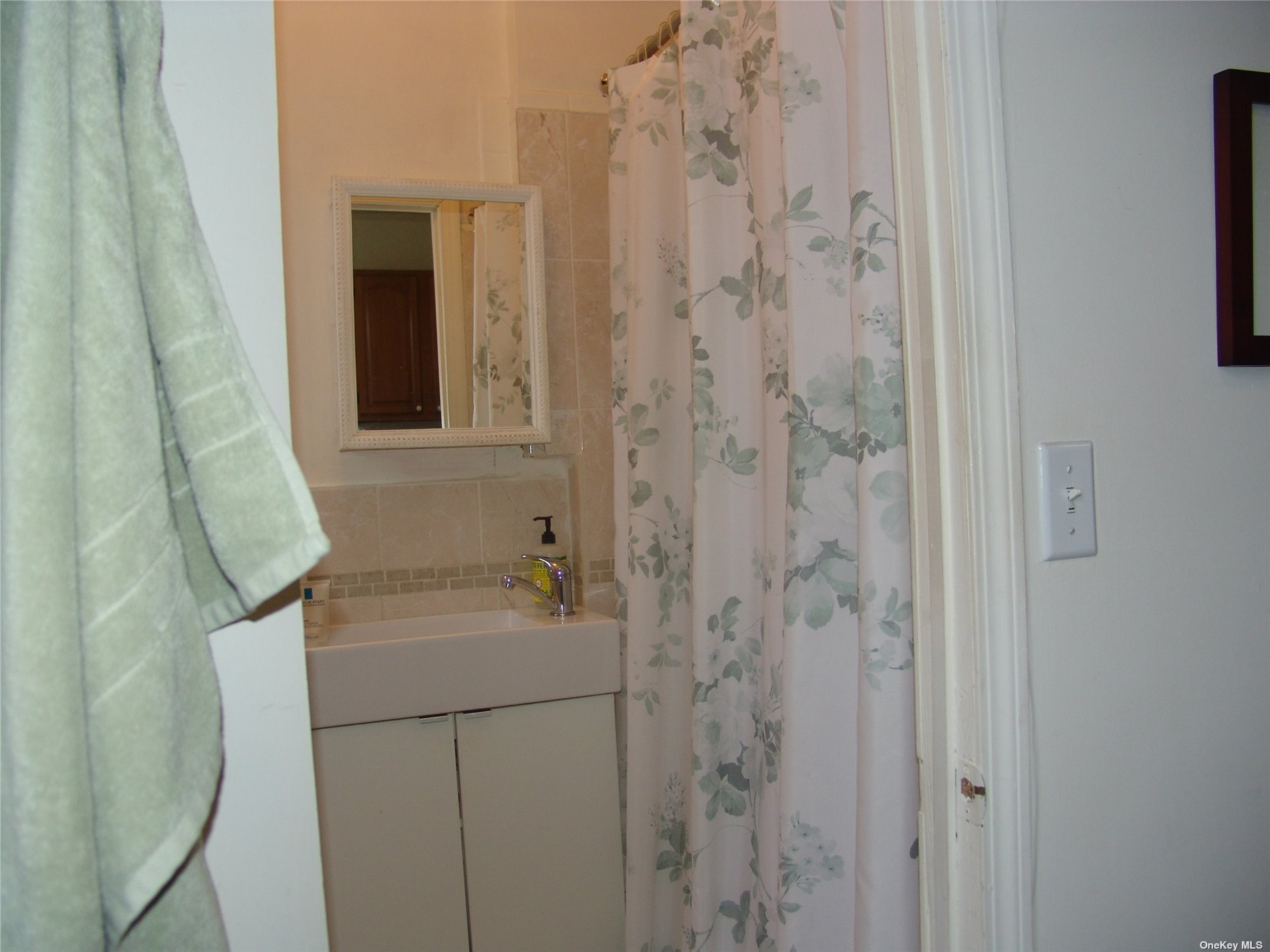 1724 8th Avenue, Unit 6 Brooklyn, NY 11215 - Photo 18 of 36 a bathroom with a sink and vanity