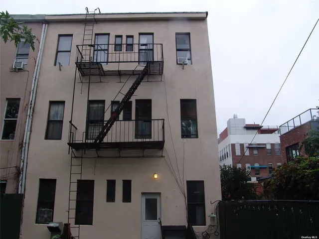 a view of a chair and table in the garden