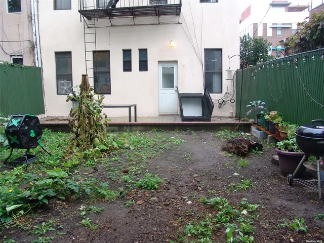 a view of a backyard with plants
