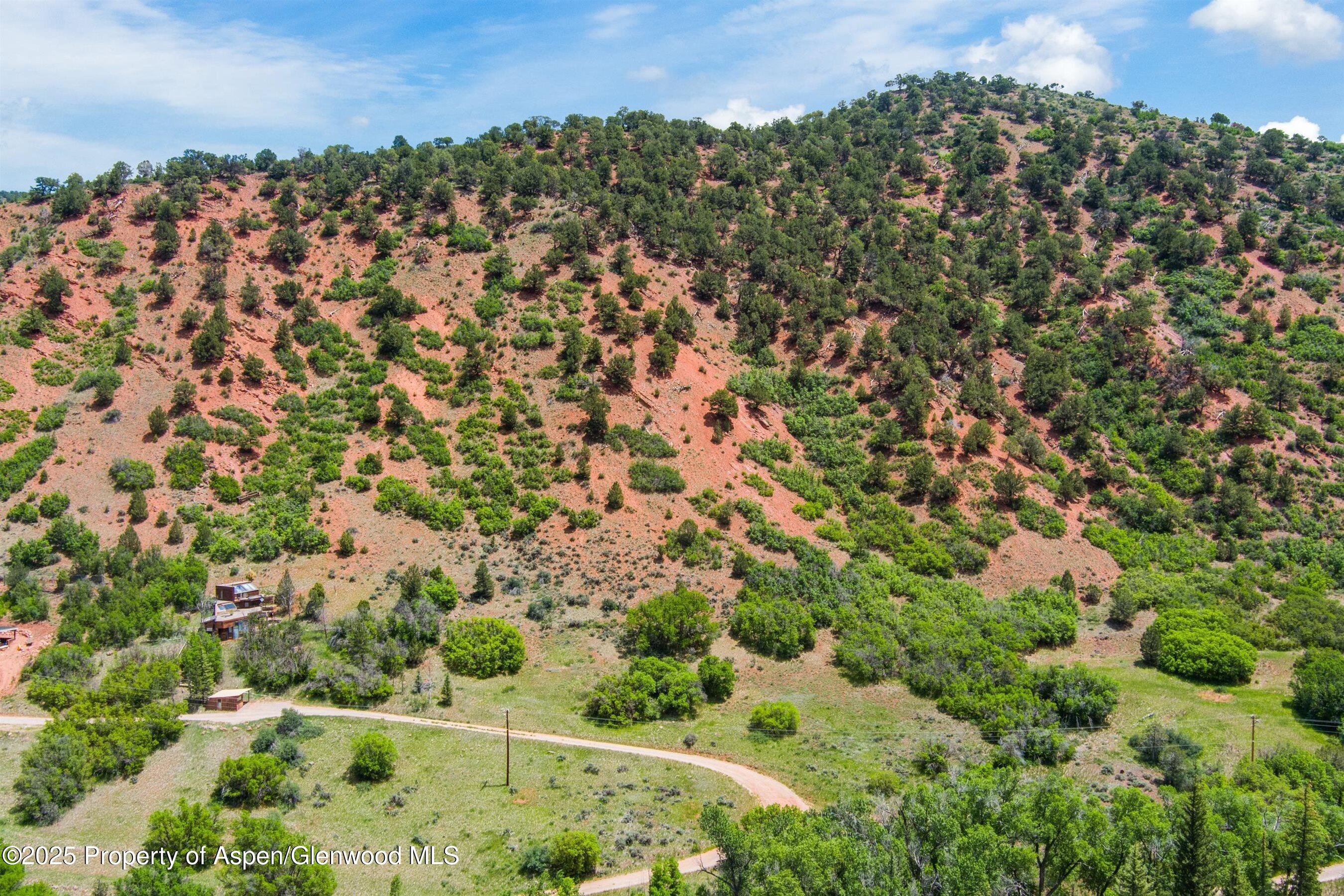 354 Snowmass Creek Road Snowmass, CO 81654 - Photo 21 of 53 an aerial view of a house with a yard