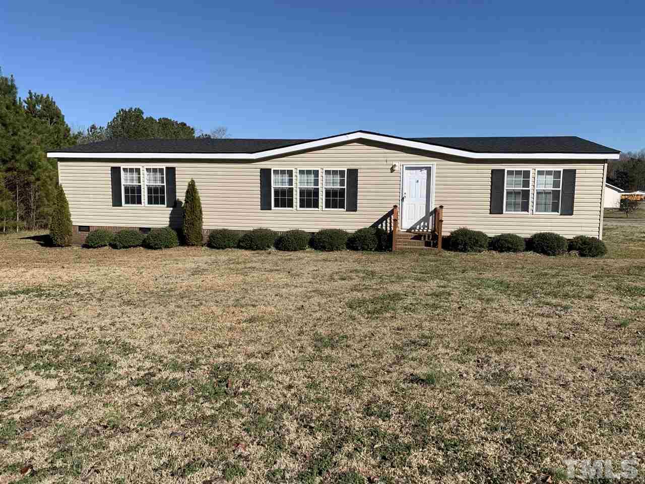 43 Williams Road Spring Hope, NC 27882 - Photo 1 of 30 a front view of a house with a garden