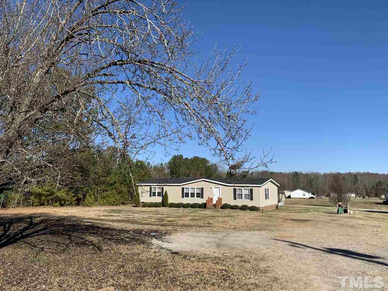 43 Williams Road Spring Hope, NC 27882 - Photo 3 of 30 a front view of a house with a yard