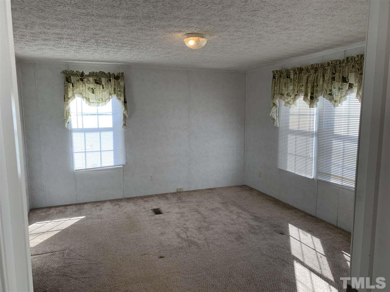43 Williams Road Spring Hope, NC 27882 - Photo 10 of 30 an empty room with a window