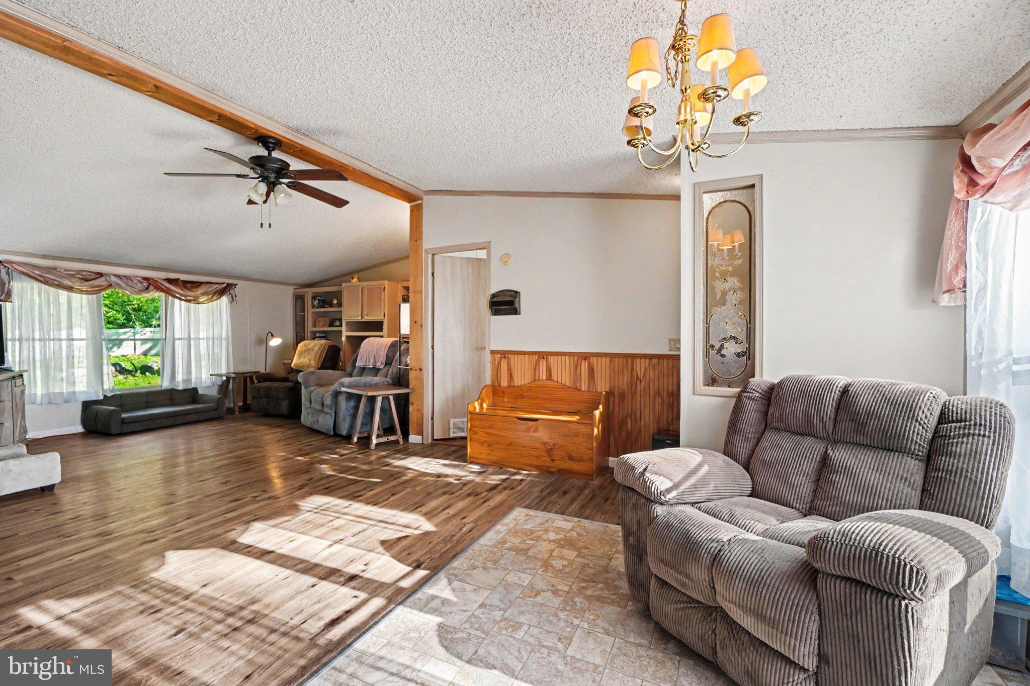 46 Pisgah Rest Shermans Dale, PA 17090 - Photo 10 of 36 a living room with furniture and a large window