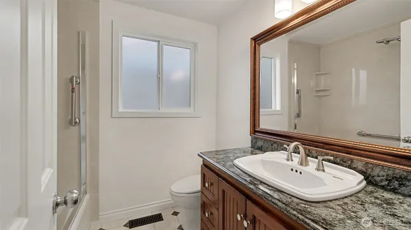 a bathroom with a sink and a toilet