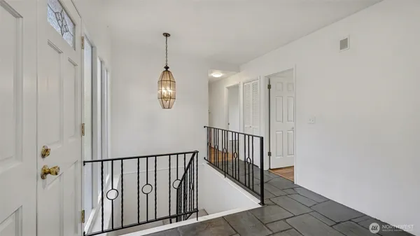 a view of a hallway with entryway door