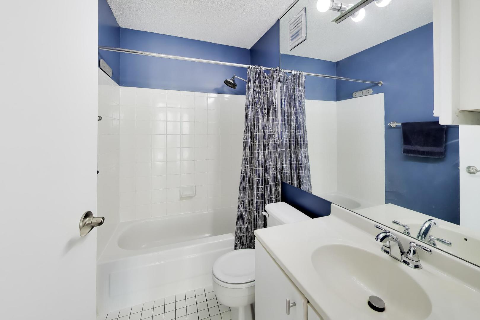 111 West Maple Street, Unit 1503 Chicago, IL 60610 - Photo 23 of 39 a bathroom with a sink toilet and shower