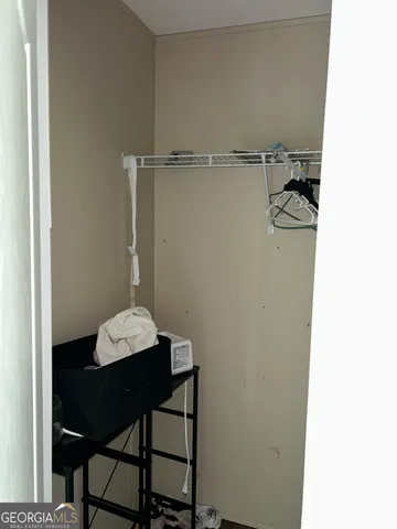 a room with a table and chairs