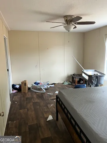 a room with a table chairs and flat screen tv