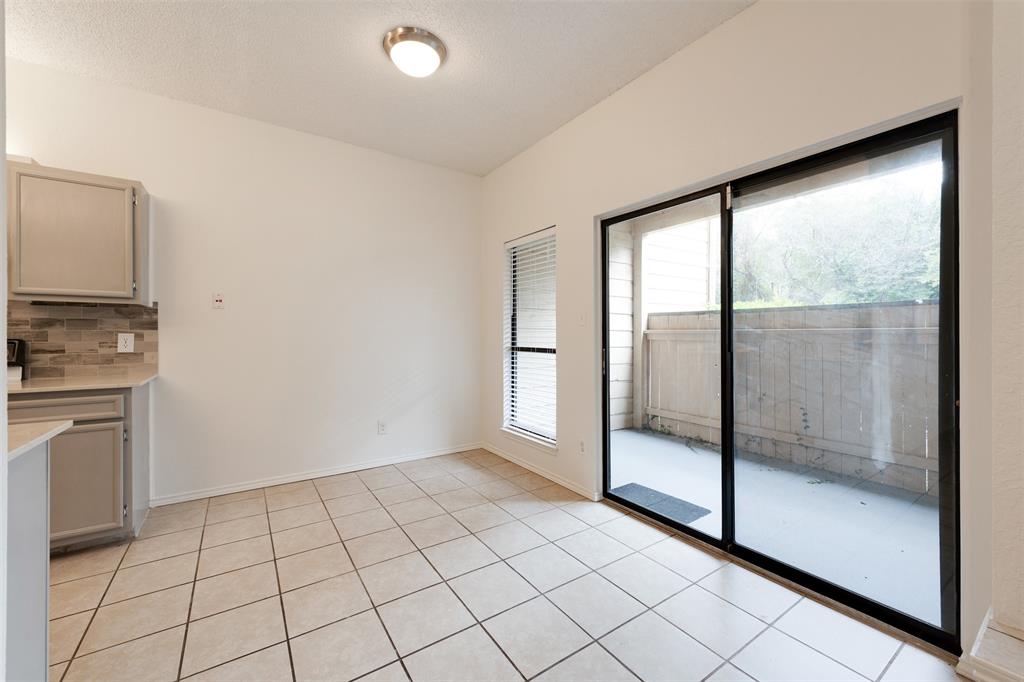 9100 Mountain Ridge Drive, Unit 105 Austin, TX 78759 - Photo 12 of 17 a view of an empty room and window