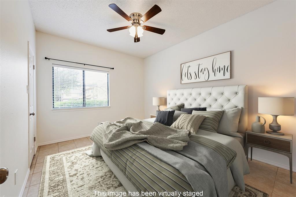 9100 Mountain Ridge Drive, Unit 105 Austin, TX 78759 - Photo 14 of 17 a bedroom with bed and a window