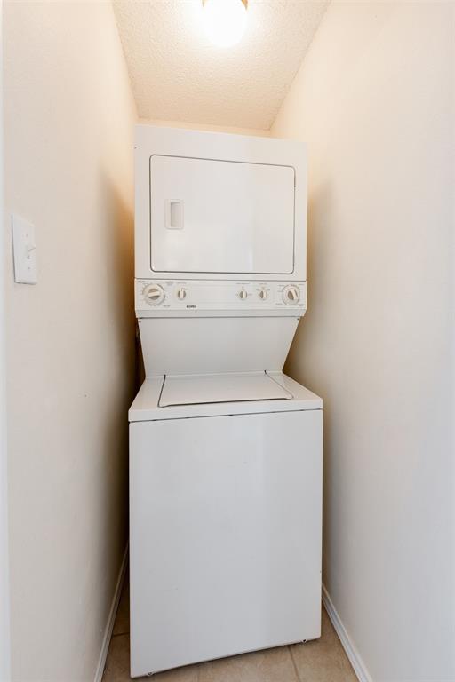 9100 Mountain Ridge Drive, Unit 105 Austin, TX 78759 - Photo 17 of 17 a utility room with dryer and washer